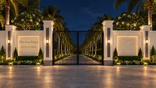 The illuminated Solitaire and More Great Projects entrance at night